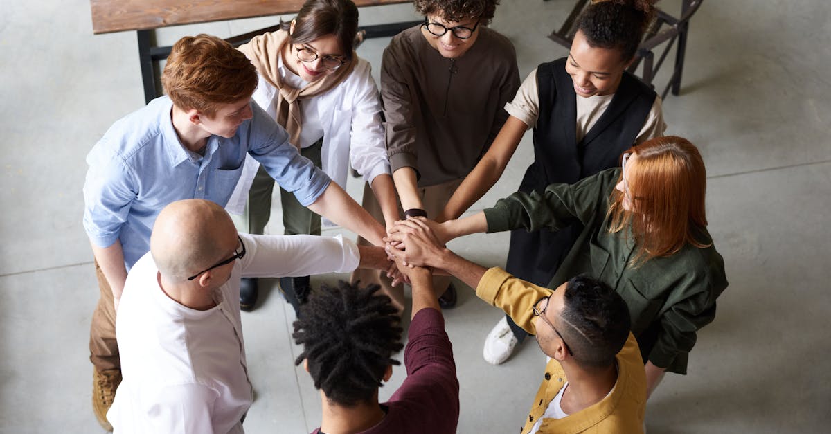 Photo Of People Holding Each Other's Hands